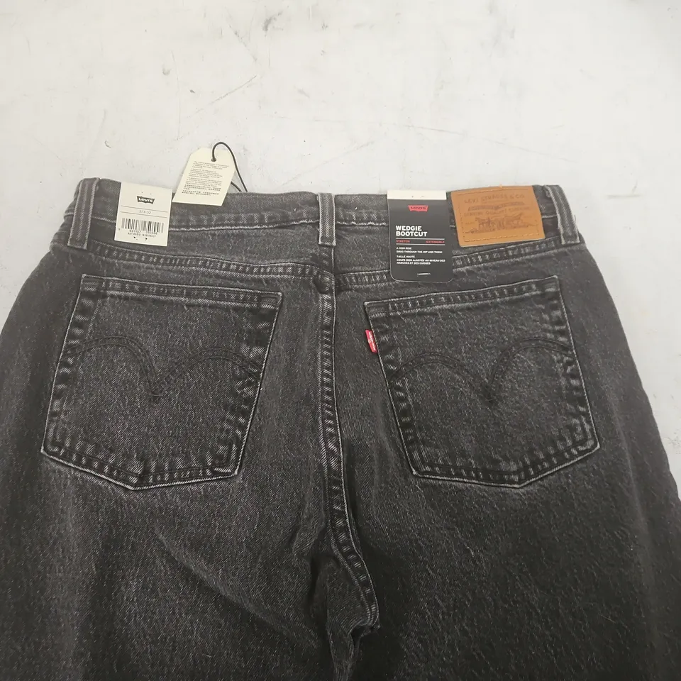 PAIR OF LEVIS WEDGIE BOOTCUT JEANS IN WASHED BLACK - 31X32