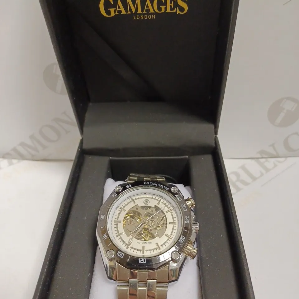 GAMAGES LONDON SKELETON FACE WATCH WITH SILVER BRACELET STRAP