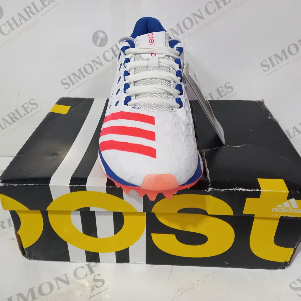 BOXED PAIR OF ADIDAS ADIZERO BOOST SL22 CRICKET SHOES IN WHITE/BLUE/RED UK SIZE 7