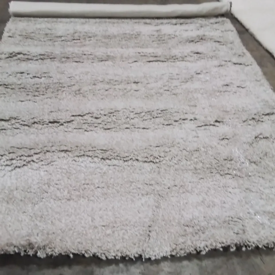 STILLAGE OF APPROXIMATELY 20 BAGGED QUALITY DESIGNER RUGS