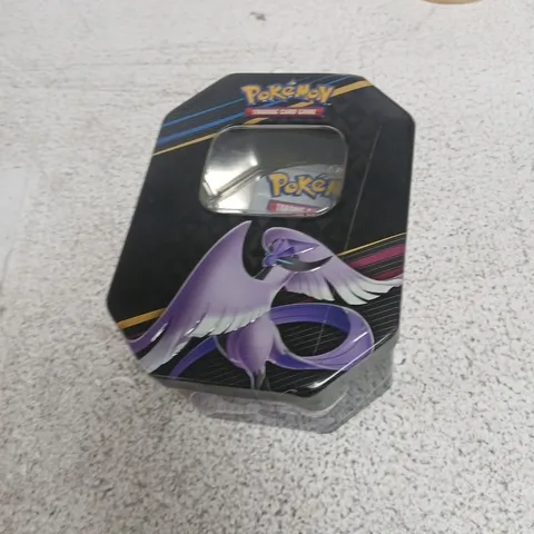POKΓMON TRADING CARD TIN WITH ASSORTED CARDS AND PHANTOM FLAMES BOOSTER PACK