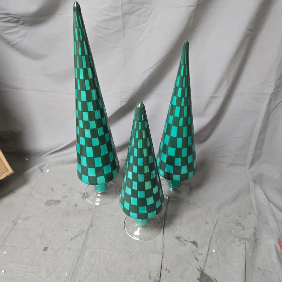 THREE TEAL CONE SCULPTURES ON CLEAR GLASS STANDS