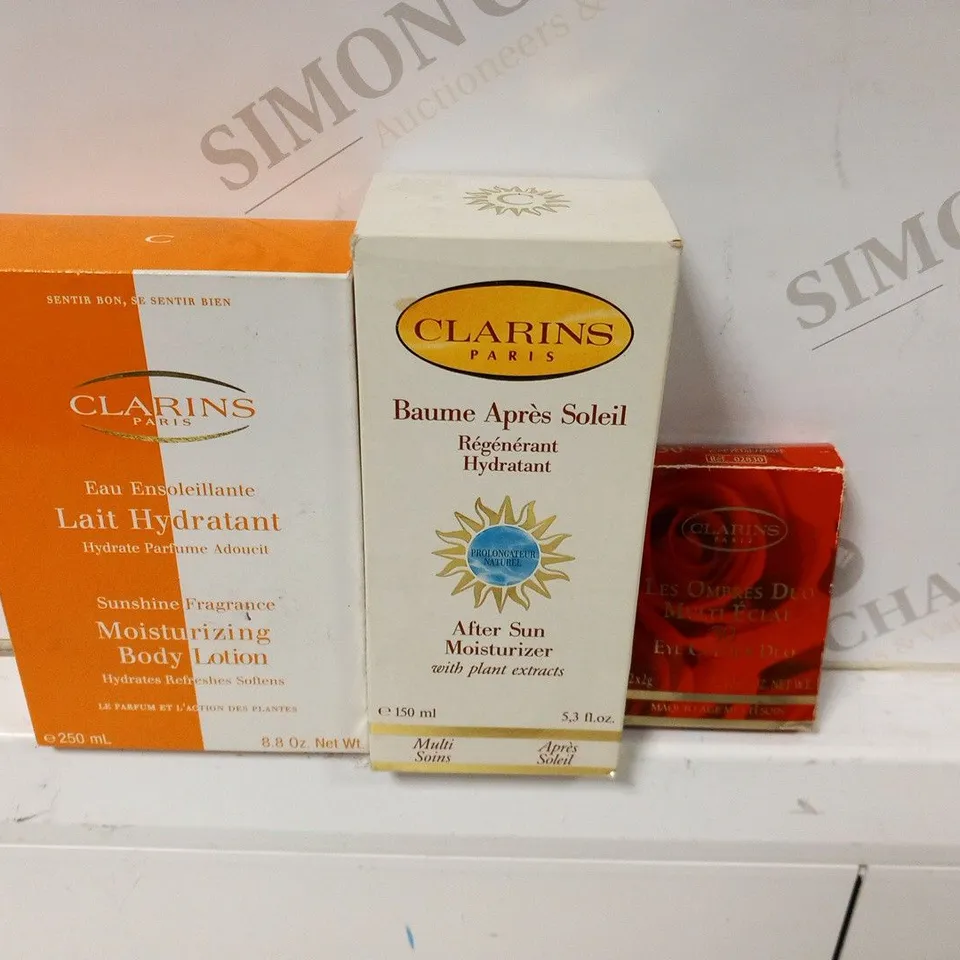 APPRXIMATELY 7 ASSORTED CLARINS PARIS CSMETICS PRODUCTS TO INCLUDE; AFTER SUN MOISTURIZER 150ML(5), SUNSHINE FRAGRANCE 250ML AND EYE COLOUR DUO