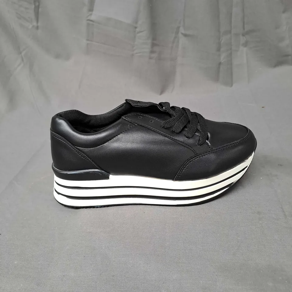 BOX OF APPROXIMATELY 12 PAIRS OF PLATFORM TRAINERS IN BLACK/WHITE - VARIOUS SIZES