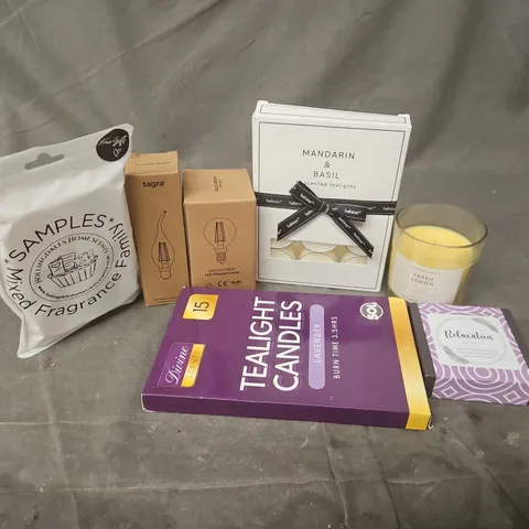 APPROXIMATELY 12 ASSORTED HOUSEHOLD ITEMS TO INCLUDE SCENTED CANDLES, SCENTED TEALIGHTS, BULBS, ETC - COLLECTION ONLY