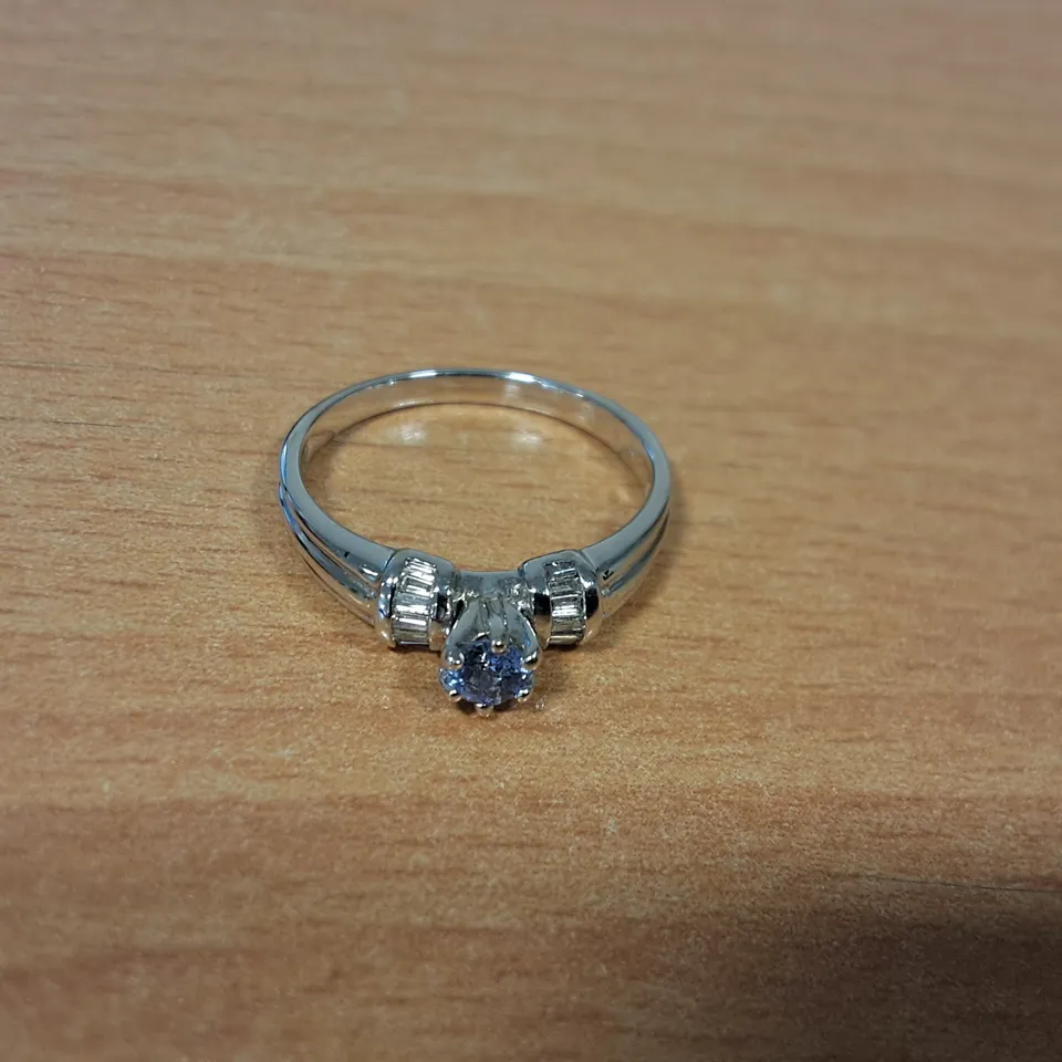 18CT WHITE GOLD RING SET WITH A TANZANITE AND NATURAL BAGUETTE CUT DIAMOND