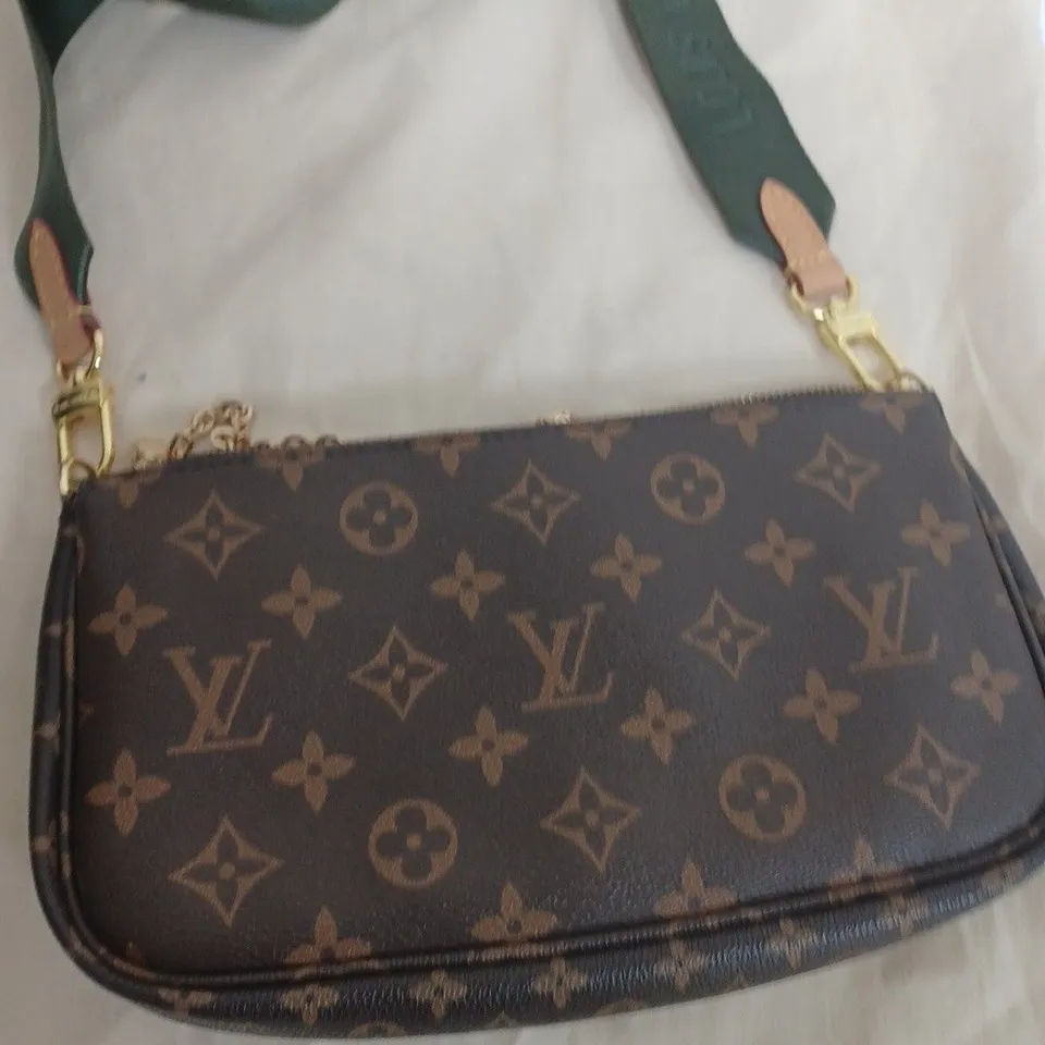 louis Vuitton hand bag in brown with green strap 