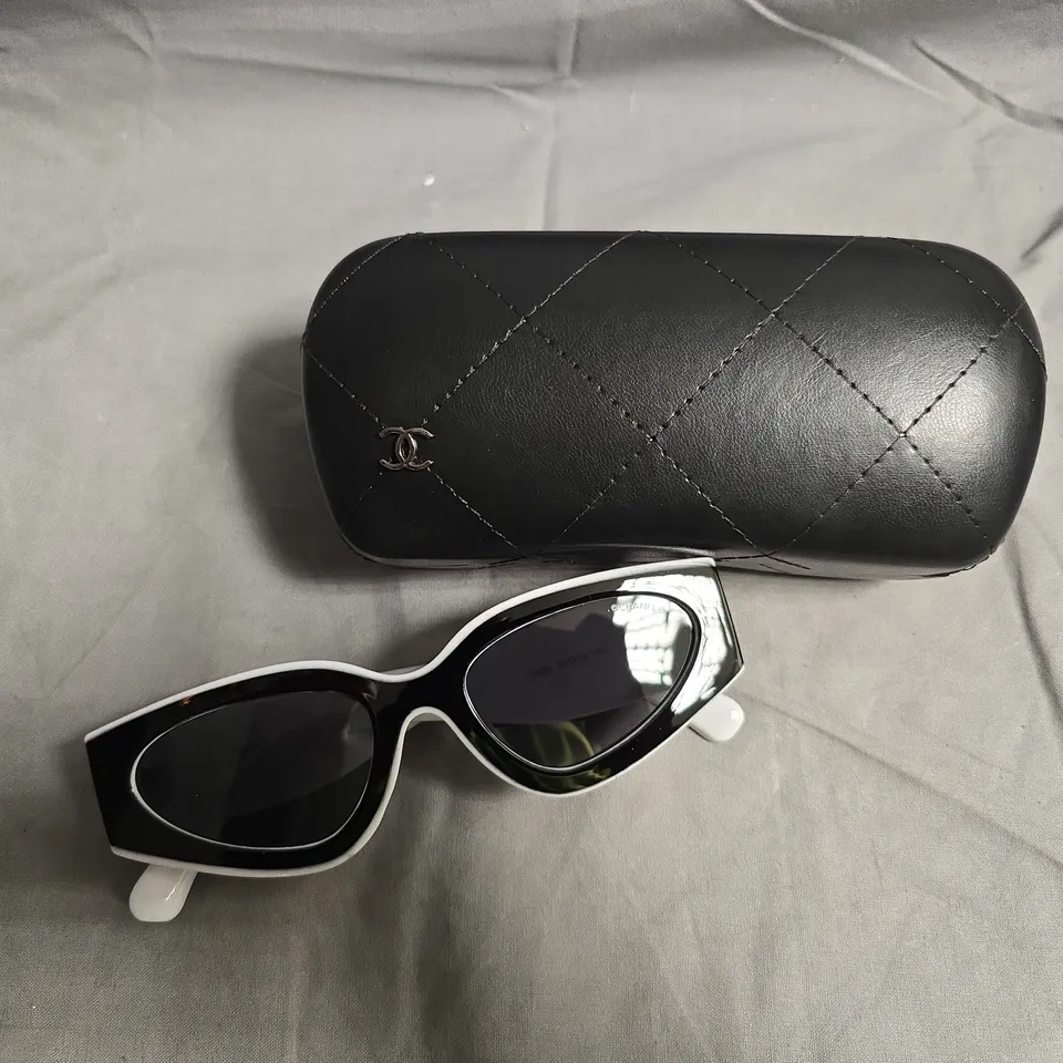 CHANEL SUNGLASSES WITH BLACK FRAMES AND WHITE ACCENTS – IN QUILTED BLACK CASE