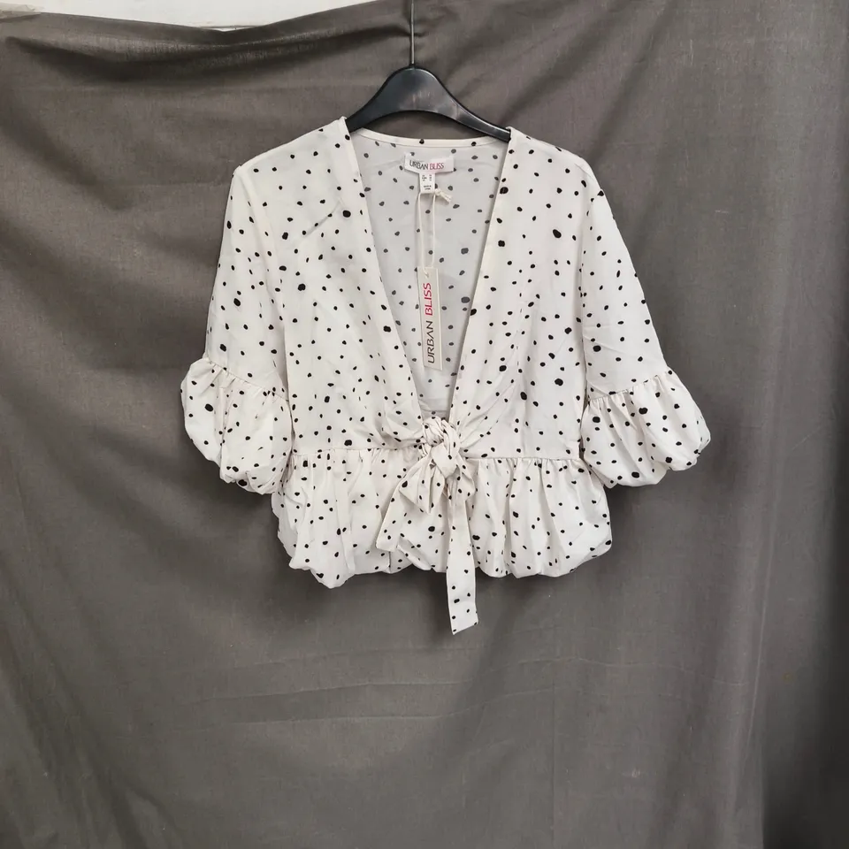 BOX OF APPROXIMATELY 90 URBAN BLISS WOMEN'S WHITE POLKA DOT WRAP BLOUSE - SIZES 8 / 10 /12 / 14 / 16 