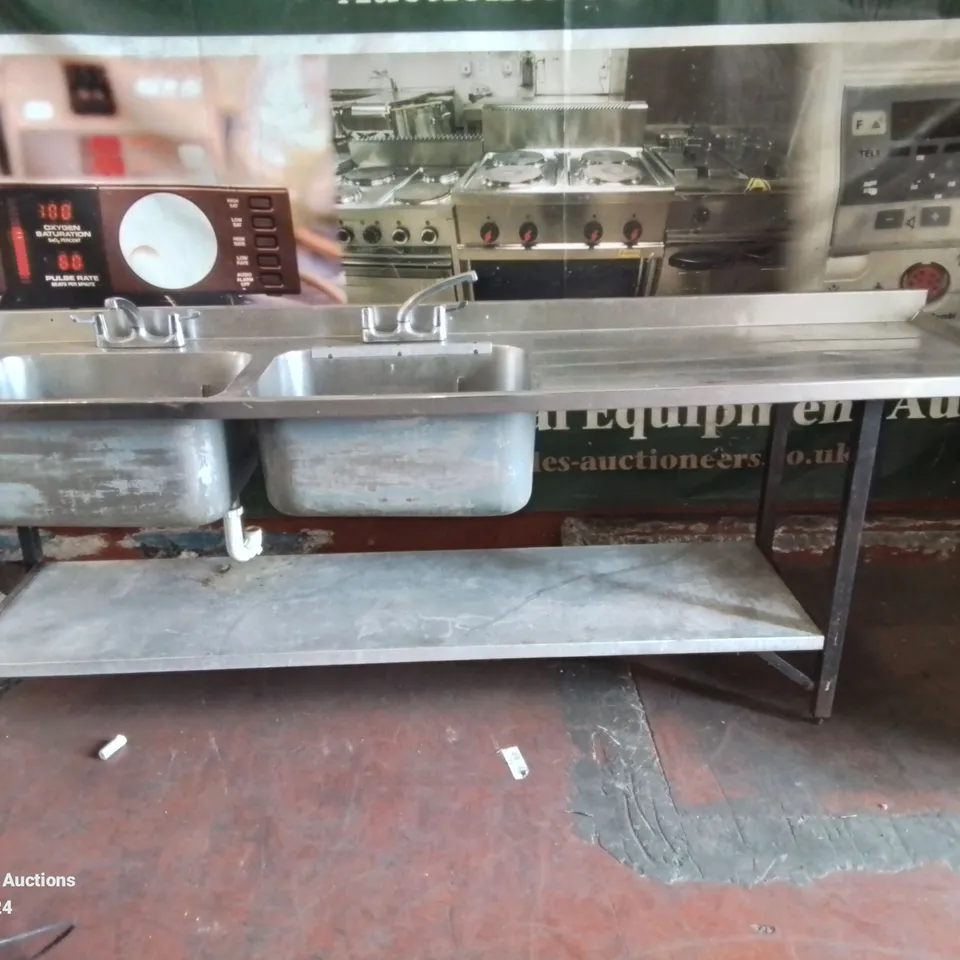 LARGE COMMERCIAL KITCHEN STAINLESS STEEL DOUBLE SINK AND DRAINAGE AREA
