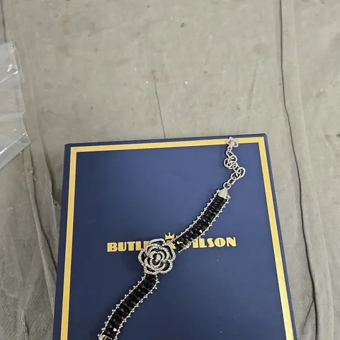 BUTLER & WILSON BRACELET WITH BLACK STONES AND CRYSTAL ROSE CENTERPIECE