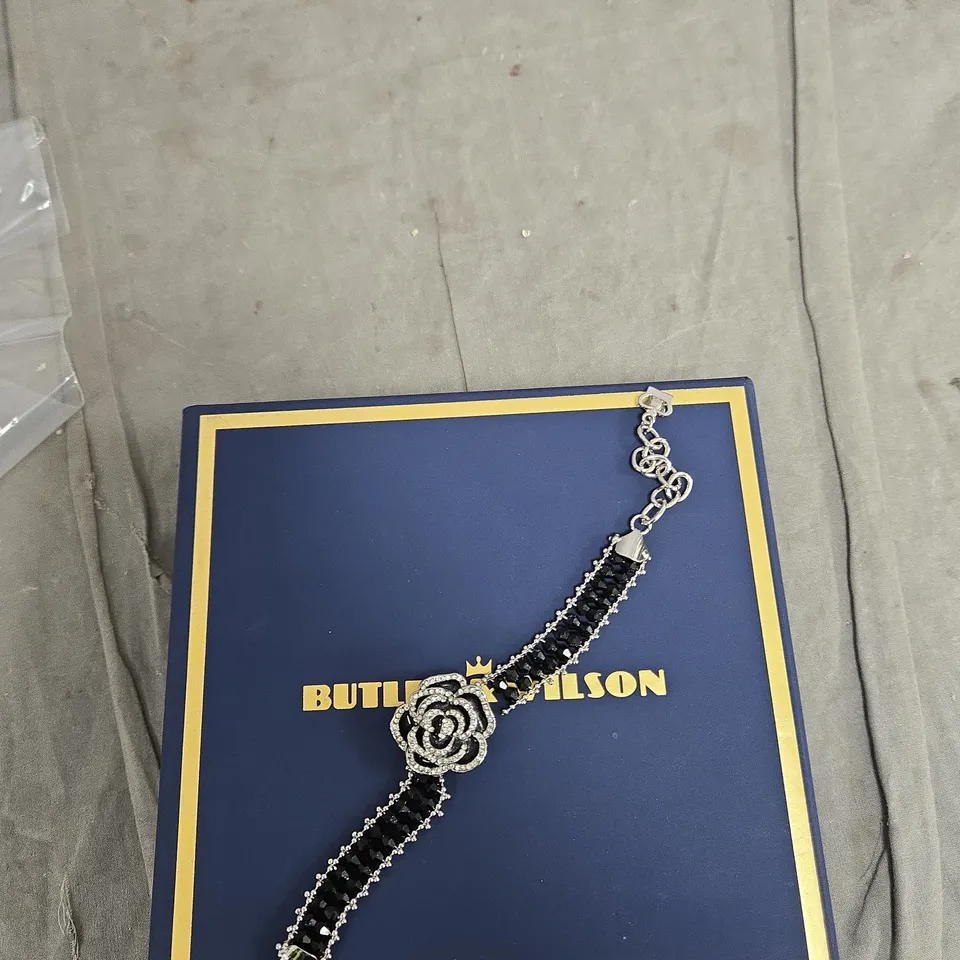 BUTLER & WILSON BRACELET WITH BLACK STONES AND CRYSTAL ROSE CENTERPIECE