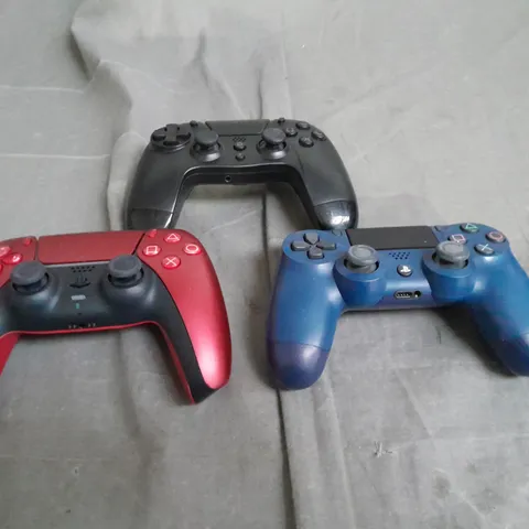 THREE ASSORTED CONTROLLERS TO INCLUDE LAYSTATION AND GOTEK