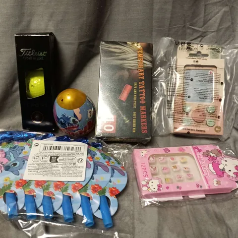 APPROXIMATELY 12 ASSORTED TOYS & GAMES PRODUCTS TO INCLUDE TITLEIST PRO V1, TEMPORARY TATTOO MARKERS, STITCH EGG TOY, ETC