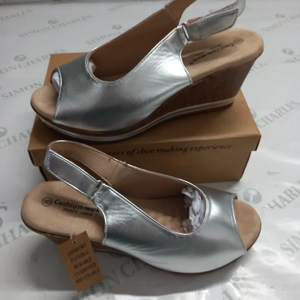 BOXED PAIR OF CUSHION WALK SILVER WEDGE HEELED SHOES - 8