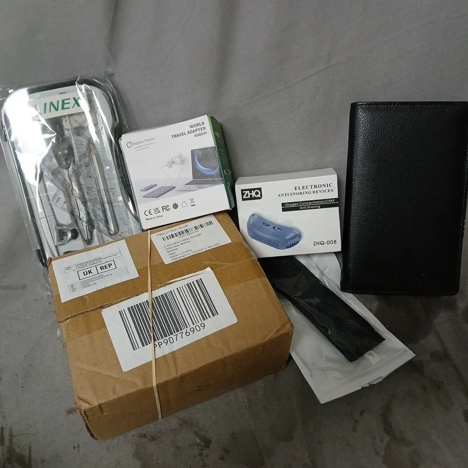 APPROXIMATELY 12 ASSORTED HOUSEHOLD ITEMS TO INCLUDE ELECTRONIC ANTI SNORING DEVICE, WORLD TRAVEL ADAPTOR, 2 INCH BALL CASTER WHEELS, ETC