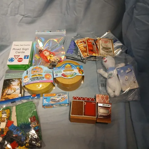 LARGE QUANTITY OF ASSORTED TOYS AND ACCESSORIES TO INCLUDE; MCDONALDS CARDS, SQUISHY BUNS, LEGO, MATCHBOX FORD RS.2000, DOLLS HOUSE FURNITURE, ROAD SIGN CARDS AND SCENTERED CHANGE OF PACE PUZZLE