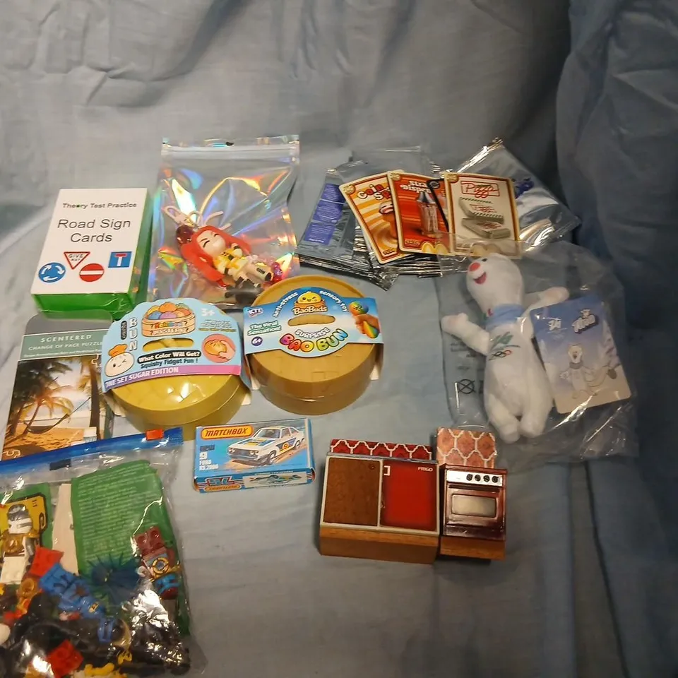 LARGE QUANTITY OF ASSORTED TOYS AND ACCESSORIES TO INCLUDE; MCDONALDS CARDS, SQUISHY BUNS, LEGO, MATCHBOX FORD RS.2000, DOLLS HOUSE FURNITURE, ROAD SIGN CARDS AND SCENTERED CHANGE OF PACE PUZZLE