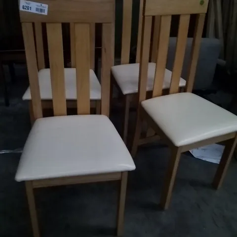 APPROXIMATELY 4 OAK EFFECT SLATTED BACK DINING CHAIRS WITH CREAM FAUX LEATHER SEAT PADS