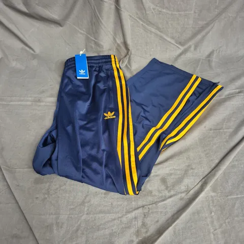ADIDAS FIREBIRD TRACK PANTS IN BLUE/YELLOW SIZE M