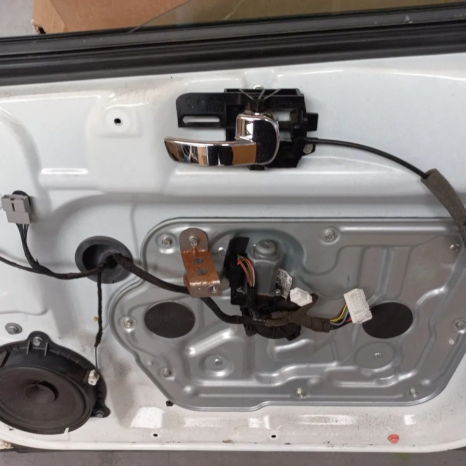 UNBOXED WHITE VEHICLE DOOR WITH INTEGRATED ELECTRONICS