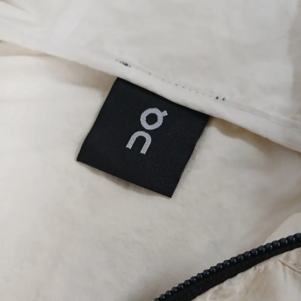 ON BEIGE WEATHERPROOF JACKET WITH BLACK ZIPPERS