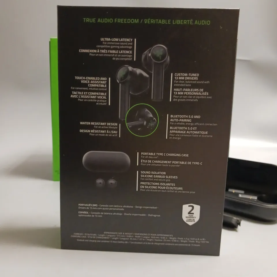 LOT OF 5 BOXED RAZER WIRELESS HEADPHONES IN BLACK AND GREEN INCLUDES CHARGING CASE, CABLE AND WRIST STRAP