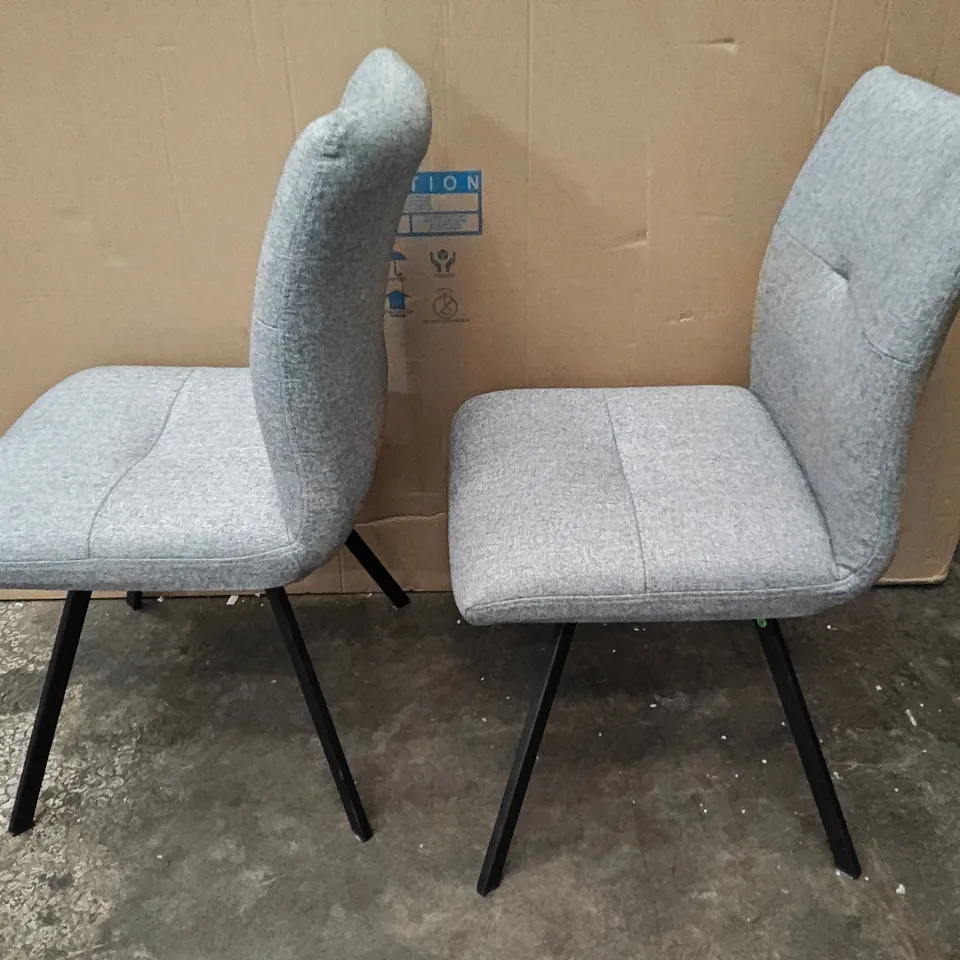 PAIR OF LIGHT GREY FABRIC ARMLESS DINING CHAIRS ON BLACK BASE