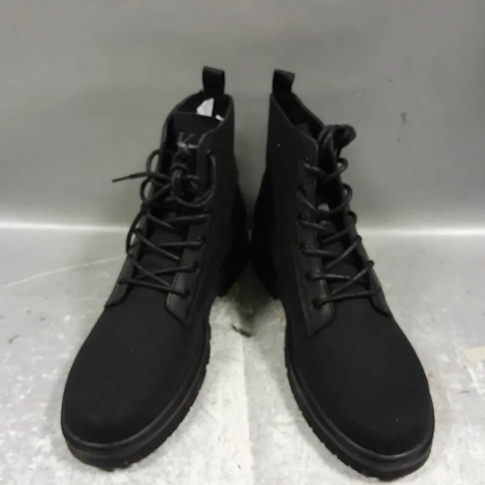 PAIR OF CALVIN KLEIN LACE UP BOOTS IN BLACK - 10.5