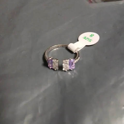RHODIUM-PLATED RING WITH TWO AMETHYST STONES AND CLEAR CUBIC ZIRCONIA