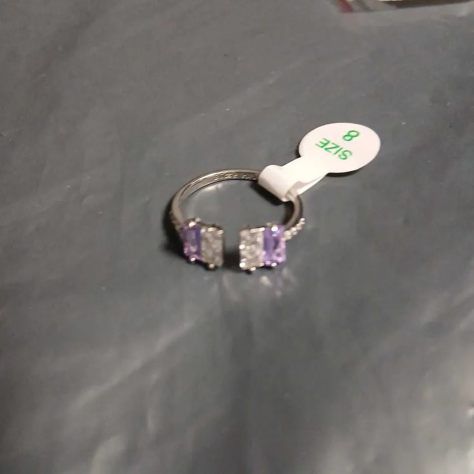 RHODIUM-PLATED RING WITH TWO AMETHYST STONES AND CLEAR CUBIC ZIRCONIA