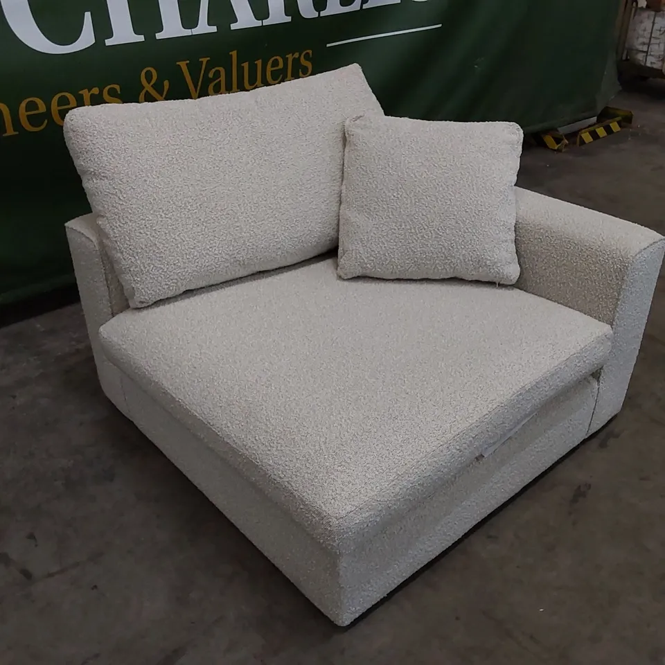 DESIGNER SOFT PIECE UPHOLSTERED IN SOFT FABRIC