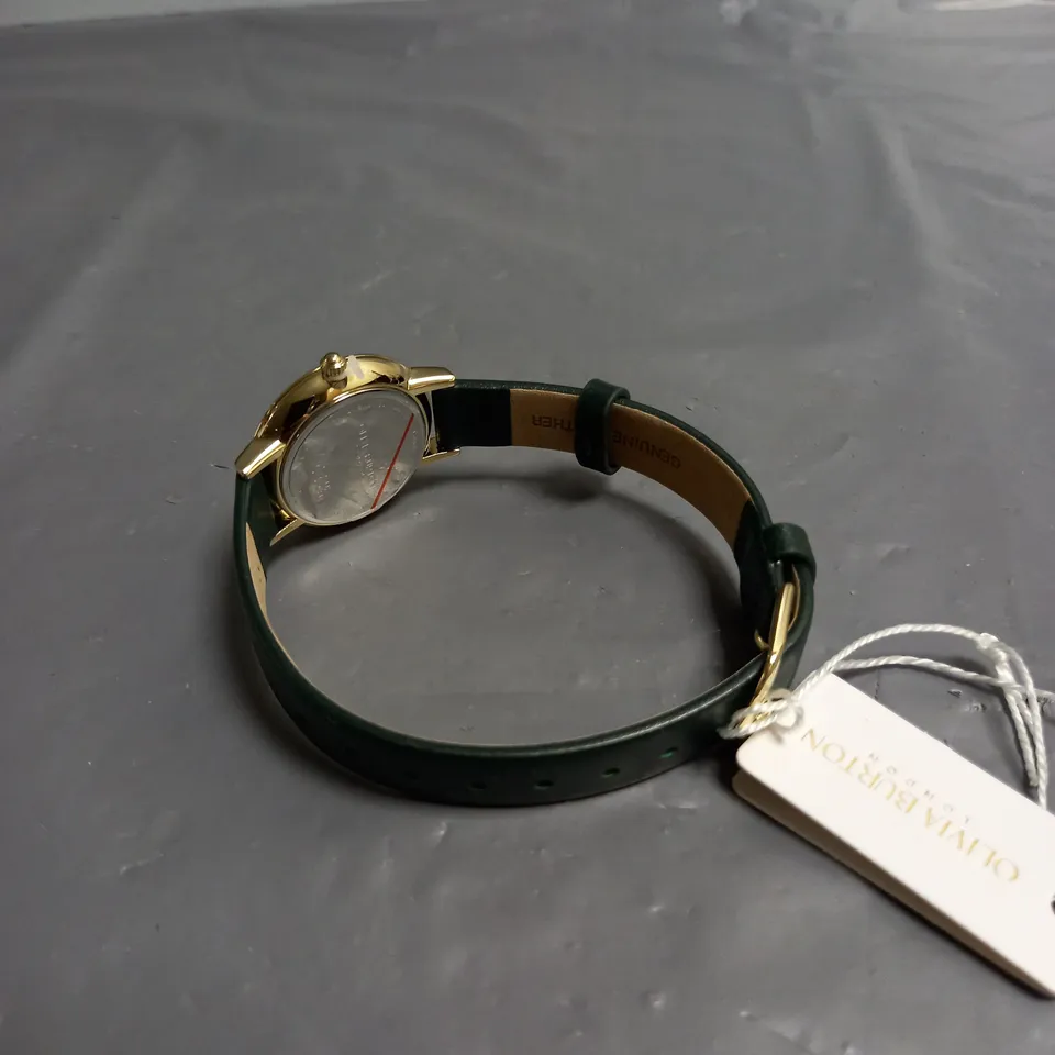 BOXED OLIVIA BURTON LONDON LADIES WATCH WITH GOLD COLOURED BEE DESIGN FACE AND GREEN LEATHER STRAP