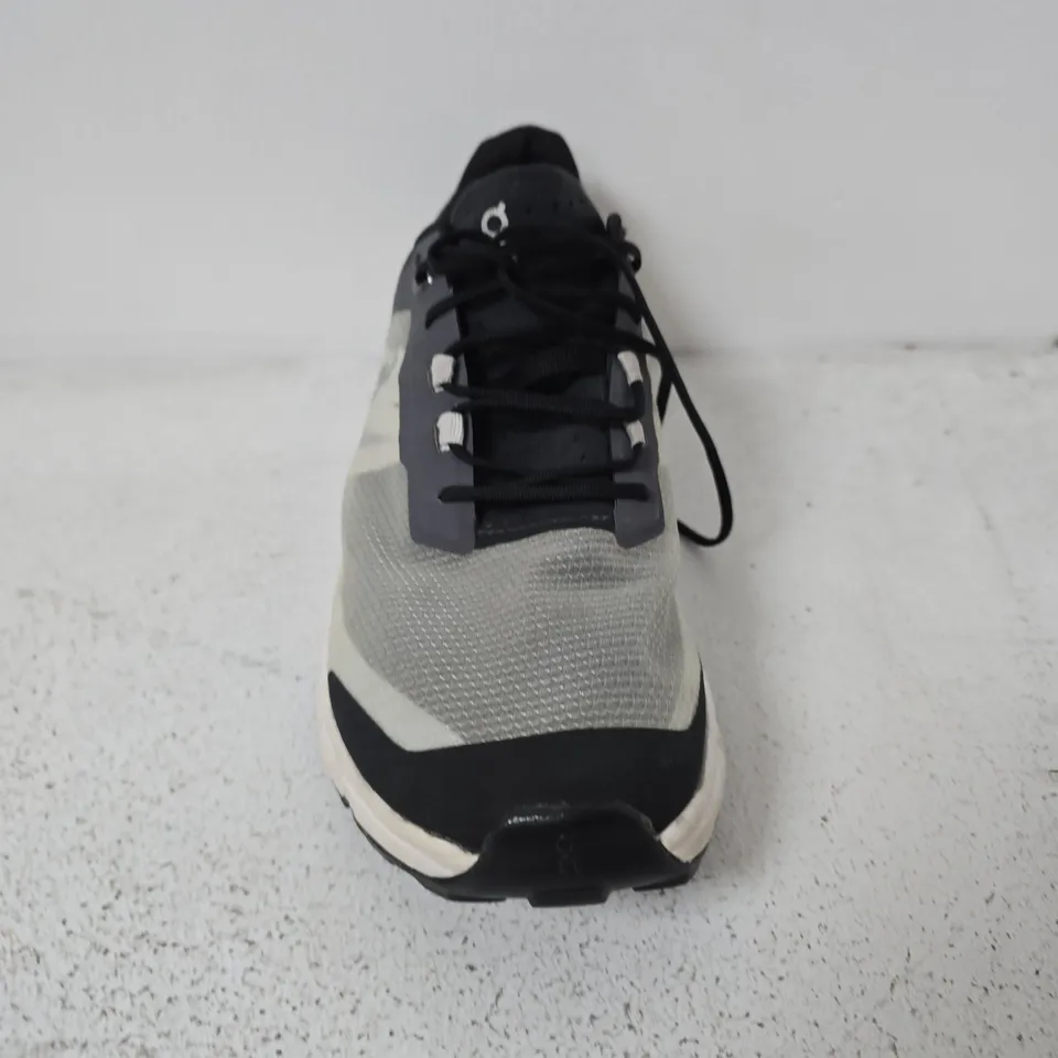 UNBOXED PAIR OF ON RUNNING CLOUDVISTA TRAIL RUNNING SHOES IN A BLACK AND WHITE COLORWAY - UK 6.5