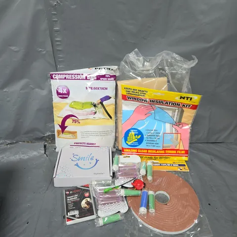 APPROXIMATELY 12 ASSORTED HOUSEHOLD ITEMS TO INCLUDE WINDOW INSULATION KIT, COMPRESSION BAG, CARD SLEEVES, ETC