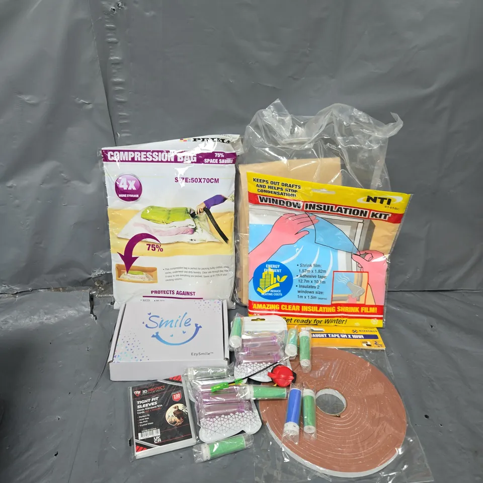 APPROXIMATELY 12 ASSORTED HOUSEHOLD ITEMS TO INCLUDE WINDOW INSULATION KIT, COMPRESSION BAG, CARD SLEEVES, ETC