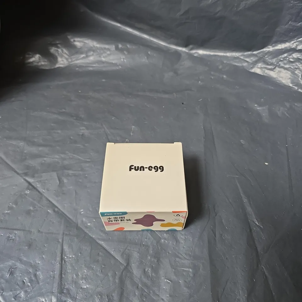 PALLET OF APPROXIMATELY 12 BOXES OF ASSORTED ITEMS INCLUDING DOG BED , FUN EGGS AND DECORATIVE WALL HANGING TILES