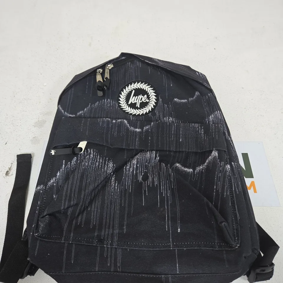 HYPE BLACK GRAFFITI BACKPACK WITH PAINT-SPLATTER DESIGN