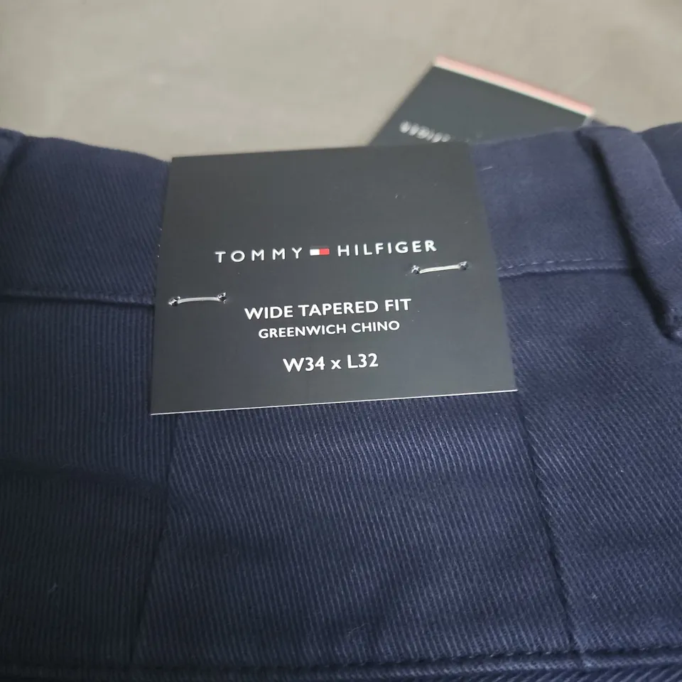 TOMMY HILFIGER W34 X L32 WIDE TAPERED FIT BLUE TROUSERS.