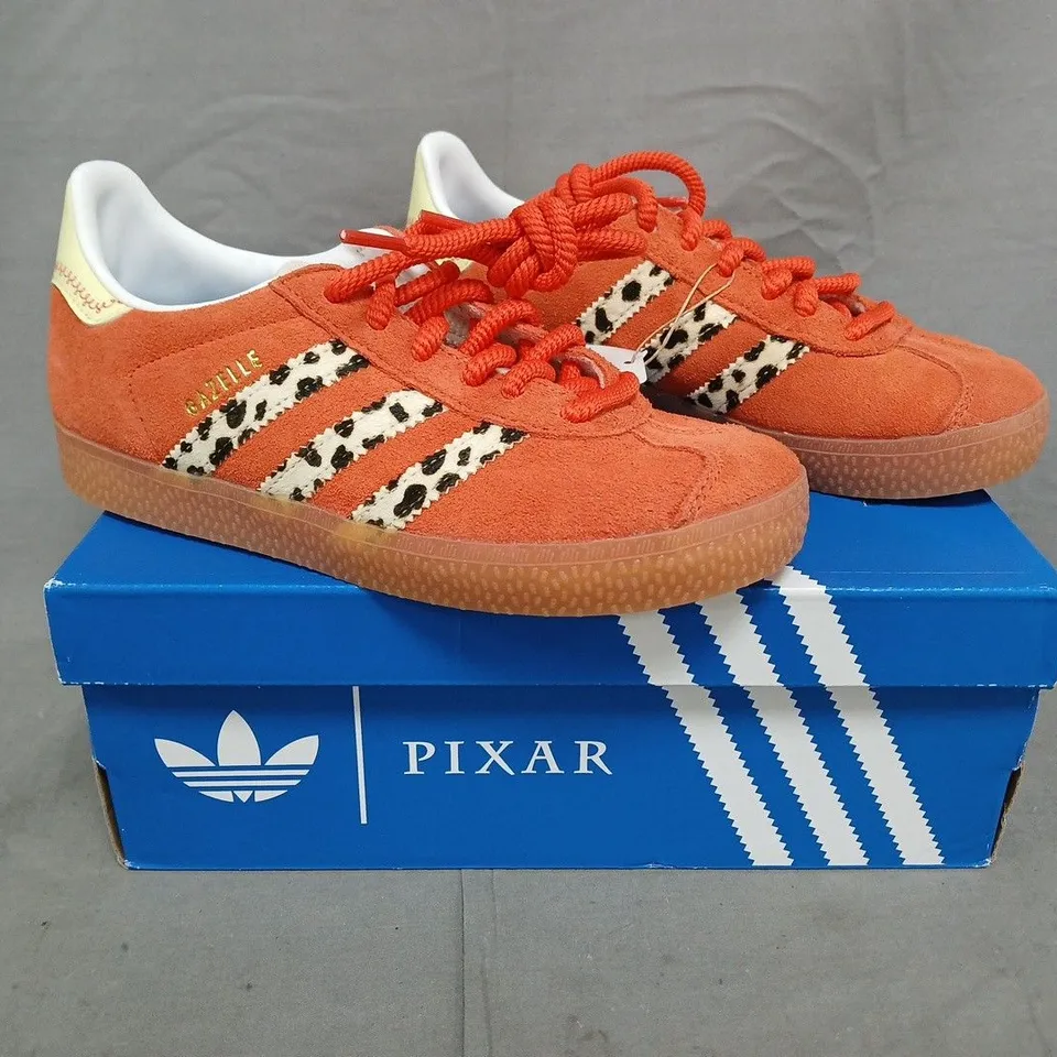 BOXED PAIR OF ADIDAS PIXAR GAZELLE SHOES IN ORANGE/MULTI SIZE UK 2