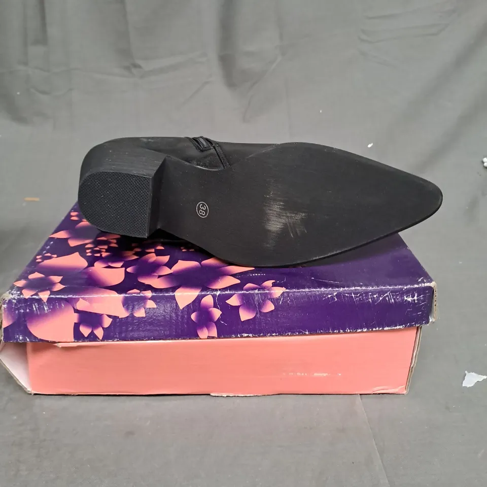 BOXED LOT OF 9 PAIRS OF LADIES BLACK BOOTS. VARIOUS SIZES