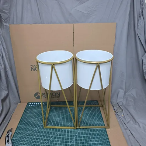 PAIR OF WHITE CERAMIC PLANTERS ON GOLD-TONE GEOMETRIC STANDS