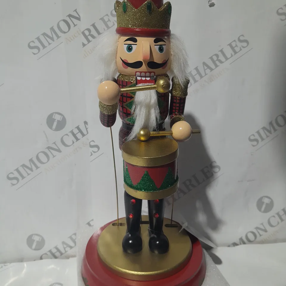 FESTIVE 32CM WOODEN ANIMATED MUSICAL NUTCRACKER