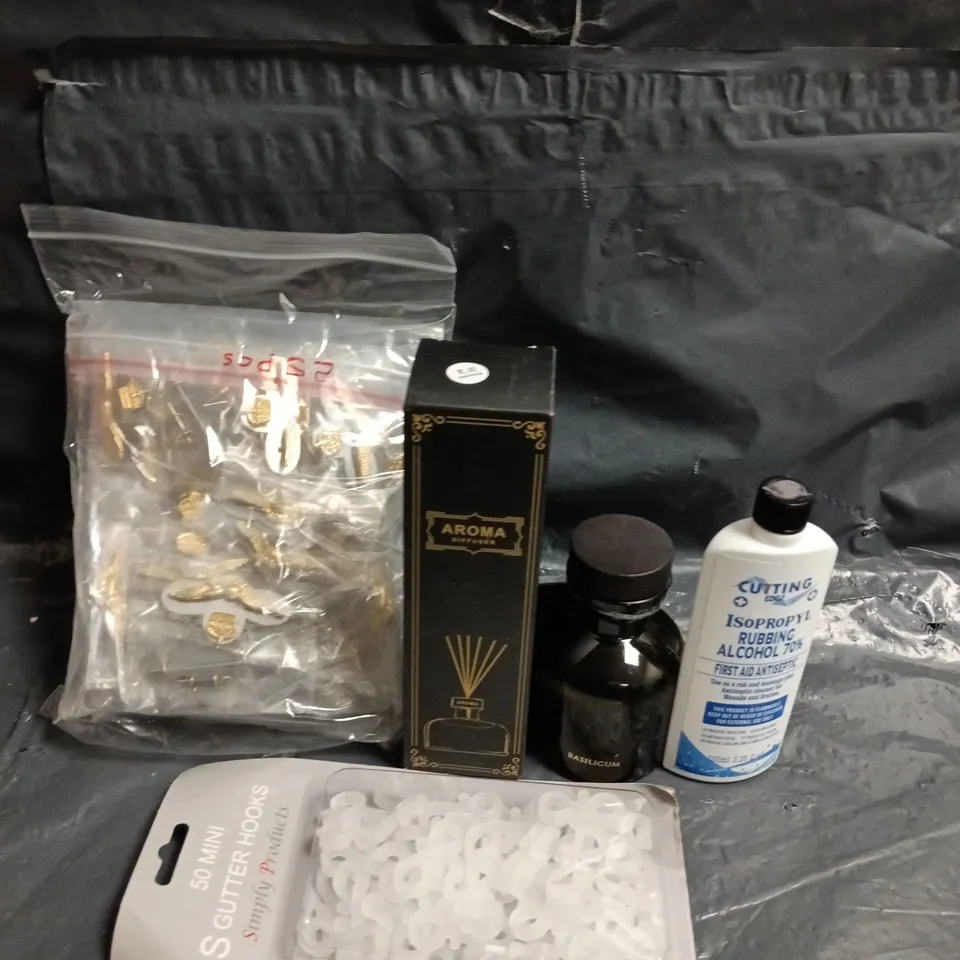 APPROXIMATELY 10 ASSORTED HOUSEHOLD ITEMS TO INCLUDE RUBBING OIL, GUTTER HOOKS AND AROMA DIFFUSER 