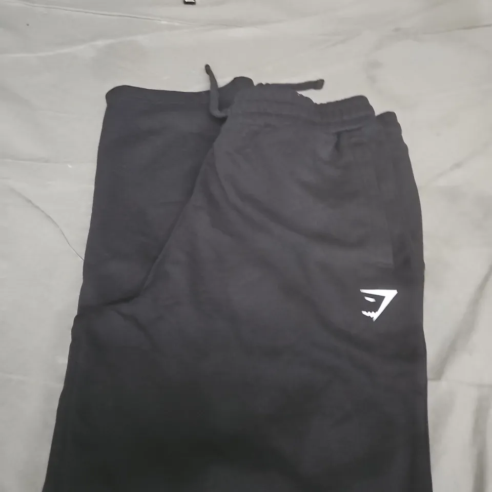 GYMSHARK BLACK DRAWSTRING TRACKSUIT BOTTOMS – SMALL WHITE LOGO ON THIGH SIZE L