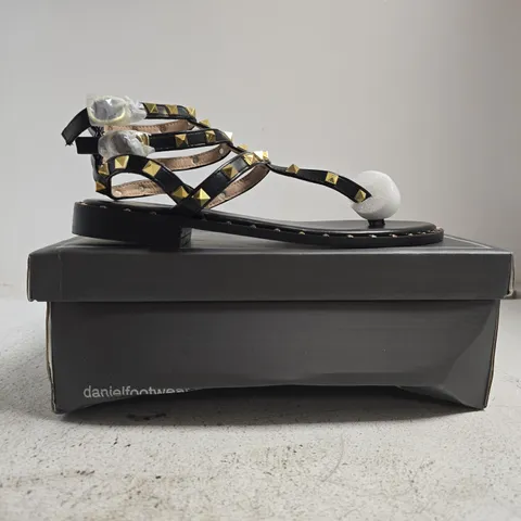 BOXED PAIR OF DANIEL TOE-POST STRAPPY SANDALS IN BLACK W. GOLD STUDS SIZE EU 39