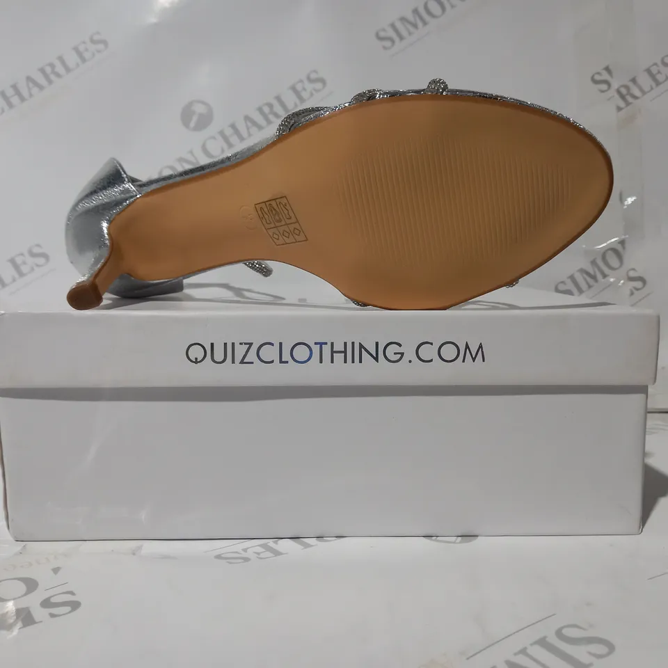 BOXED PAIR OF QUIZ OPEN TOE STRAPPY HEELED SANDALS IN METALLIC SILVER W. JEWEL EFFECT SIZE 8