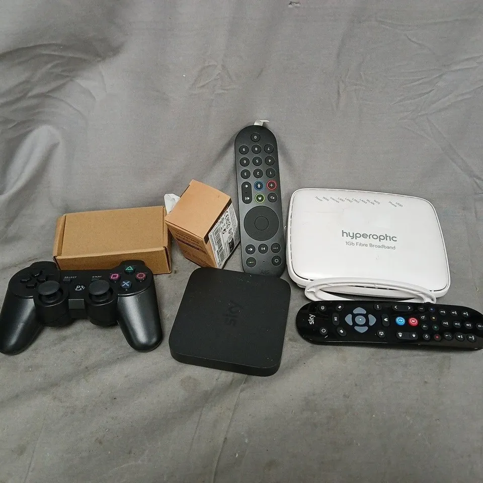 APPROXIMATELY 12 ASSORTED HOUSEHOLD ITEMS TO INCLUDE ROUTERS, REMOTES, CABLES, ETC