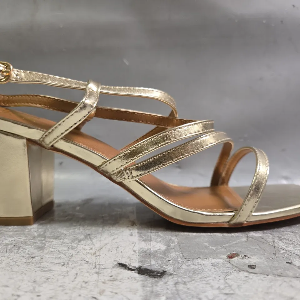 BOXED PAIR OF WHERE'S THAT FROM OPEN TOE BLOCK HEEL SANDALS IN METALLIC GOLD SIZE UK 7