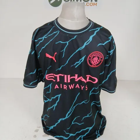 PUMA MANCHESTER CITY FOOTBALL SHIRT – 2023/24 THIRD KIT, BLACK WITH TURQUOISE BOLT PATTERN